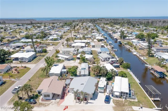 an aerial view of residential building and ocean