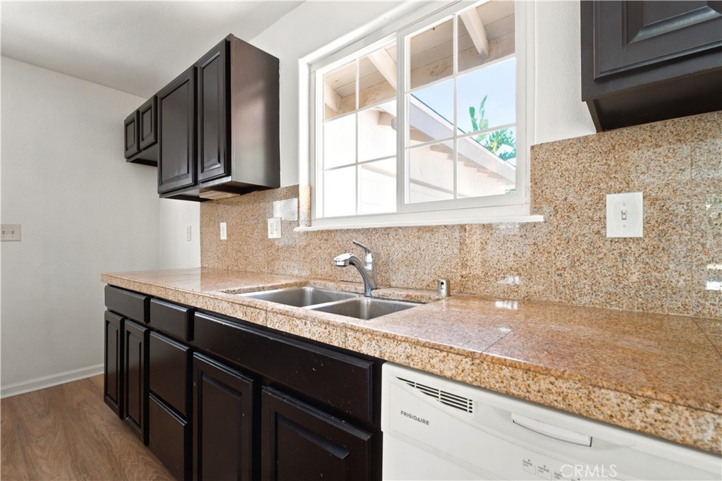 1720 Anderson Street Simi Valley, CA 93065 - Photo 7 of 30 a kitchen with a sink and a microwave