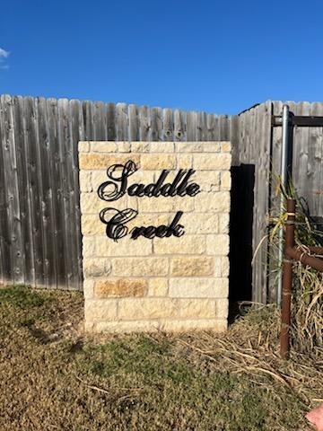 9928 Ridings Drive Waco, TX 76708 - Photo 2 of 3 a view of a wooden fence