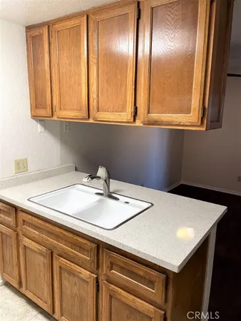 a bathroom with a sink and two mirror