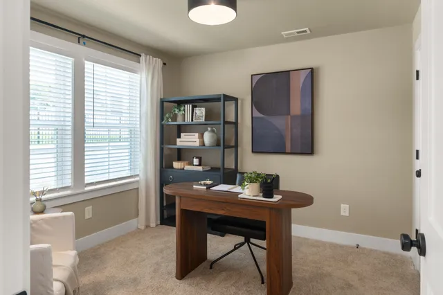 a workspace with furniture and window