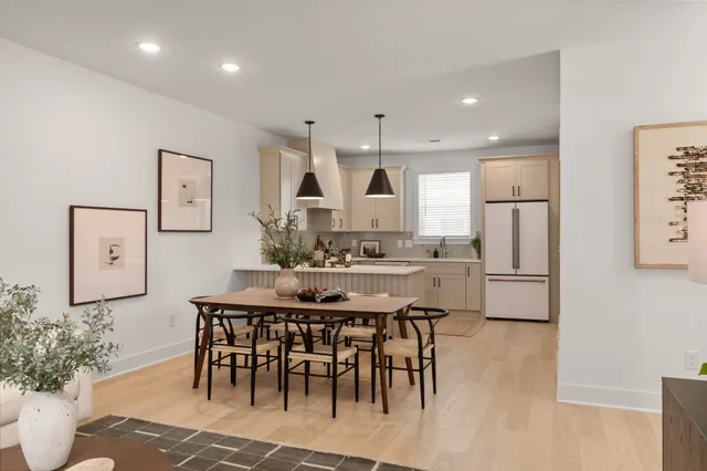 a kitchen with a table and chairs in it