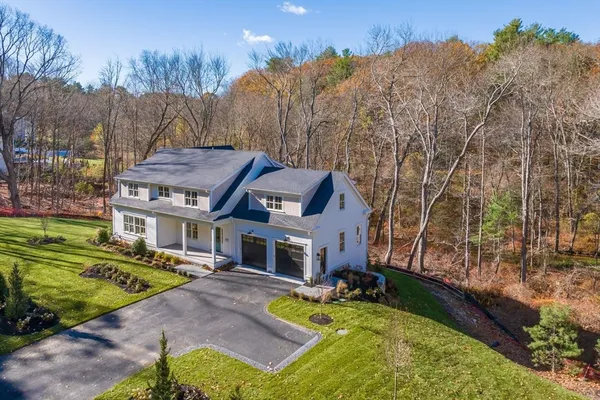 aerial view of a house with a yard