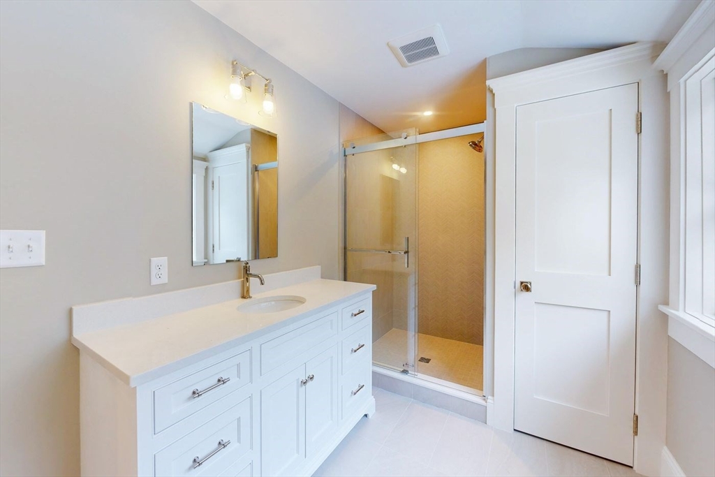 298 Summer Street Westwood, MA 02090 - Photo 14 of 24 a bathroom with a double vanity sink mirror and double