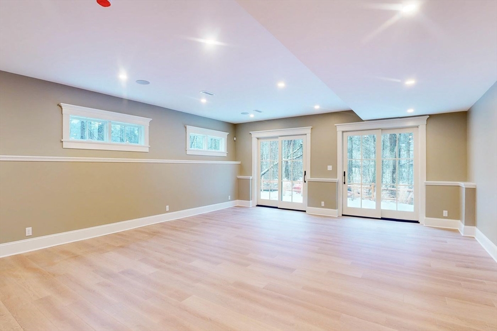 298 Summer Street Westwood, MA 02090 - Photo 18 of 24 a view of an empty room with wooden floor and a window
