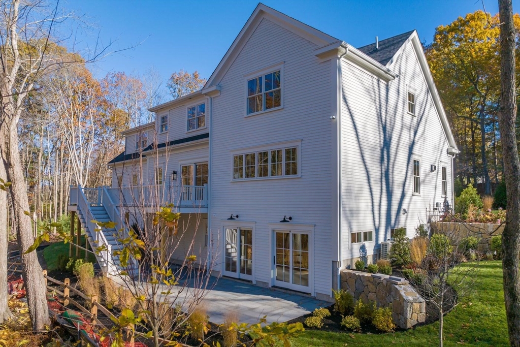298 Summer Street Westwood, MA 02090 - Photo 21 of 24 a front view of a house with garden