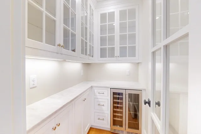 a view of an entryway with wooden floor