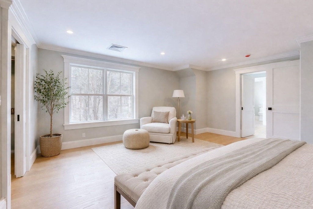 298 Summer Street Westwood, MA 02090 - Photo 10 of 24 a spacious bedroom with a bed and a large window