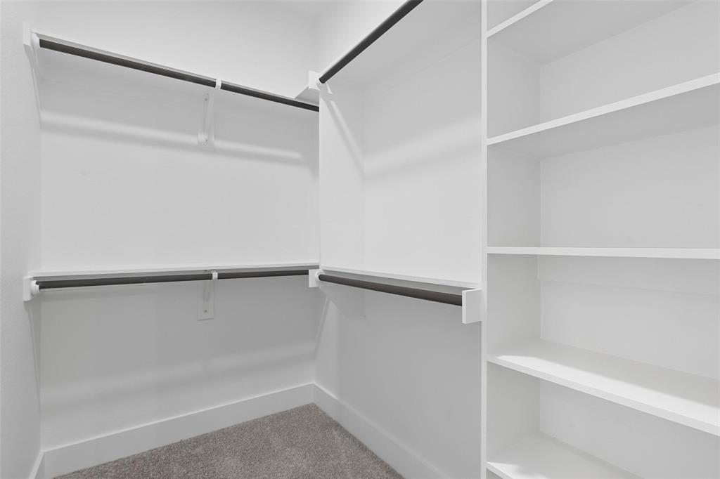 1005 Ronnie Court Springtown, TX 76082 - Photo 19 of 27 Walk in closet with light colored carpet