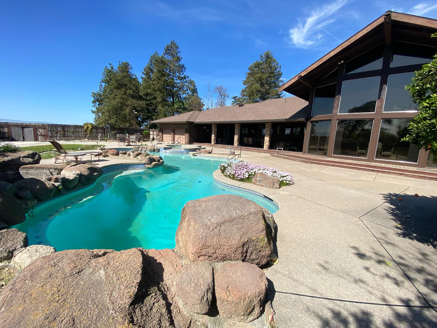 24916 Manteca Road Manteca, CA 95337 - Photo 7 of 16 a view of a swimming pool with a garden