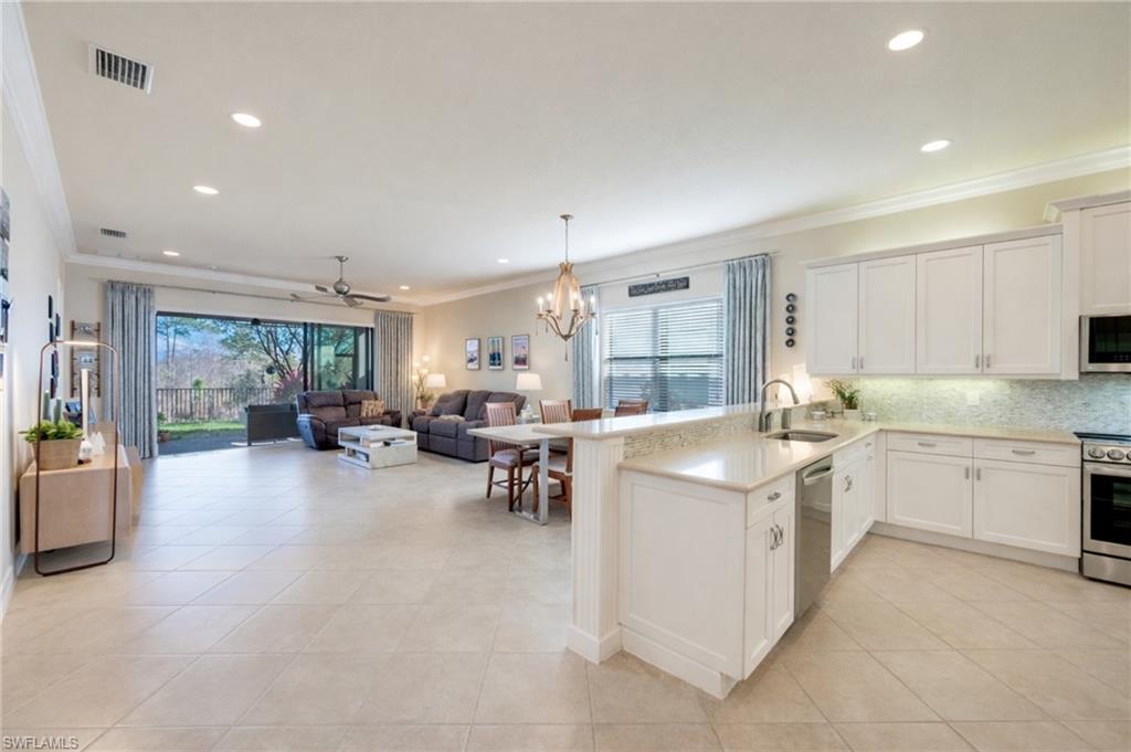 3407 Baltic Drive Naples, FL 34119 - Photo 31 of 31 a kitchen with sink and cabinets