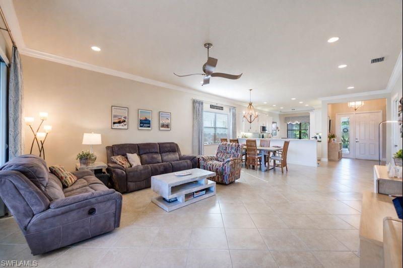 3407 Baltic Drive Naples, FL 34119 - Photo 13 of 31 a living room with furniture and a large window