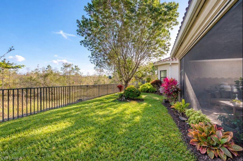 3407 Baltic Drive Naples, FL 34119 - Photo 21 of 31 a view of a backyard with potted plants