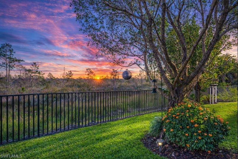 3407 Baltic Drive Naples, FL 34119 - Photo 22 of 31 a view of a backyard with a large tree