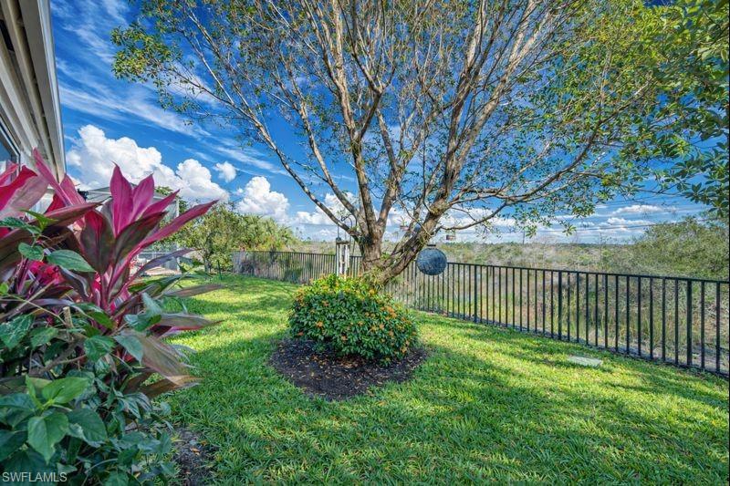 3407 Baltic Drive Naples, FL 34119 - Photo 23 of 31 a view of a backyard with garden