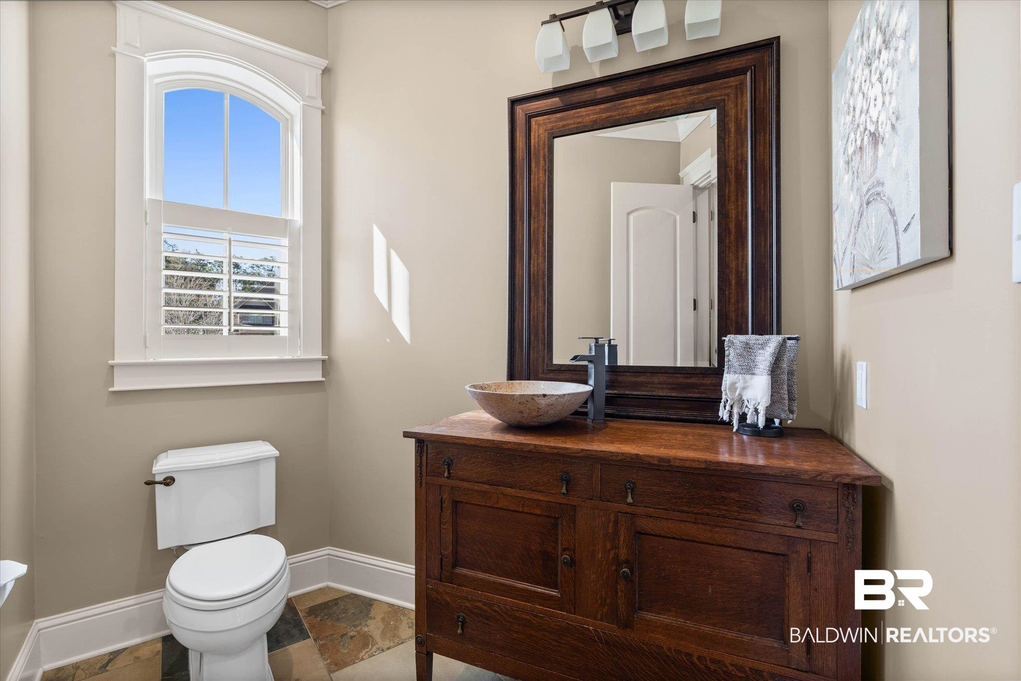 7676 Rockstone Lane Mobile, AL 36695 - Photo 23 of 47 Half bathroom featuring vanity and dark stone finish floors