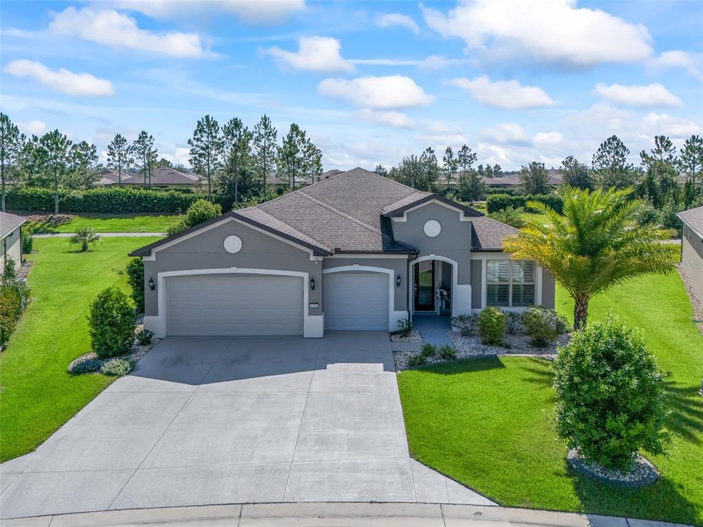 6339 Southwest 97th Terrace Road Ocala, FL 34481 - Photo 1 of 1 a front view of a house with garden