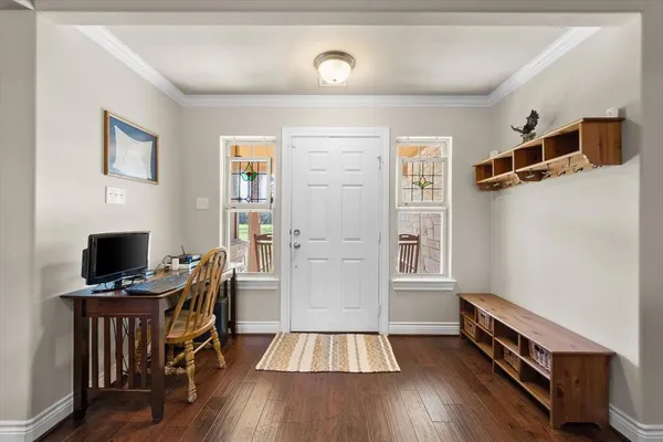 a view of a dining room with furniture and wooden floor