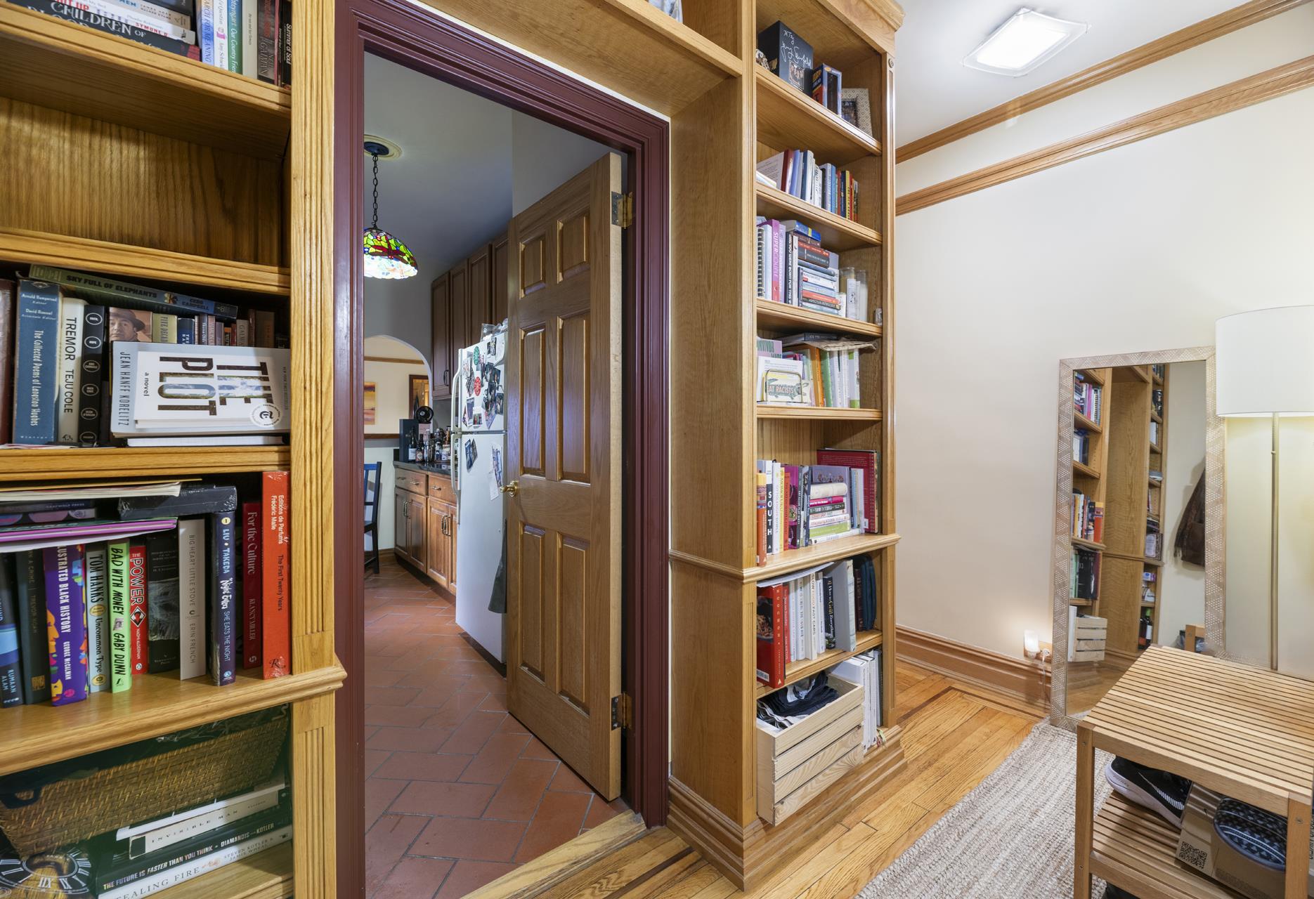170 East 94th Street, Unit 5E Manhattan, NY 10128 - Photo 4 of 8 a view of living room with furniture and book shelf