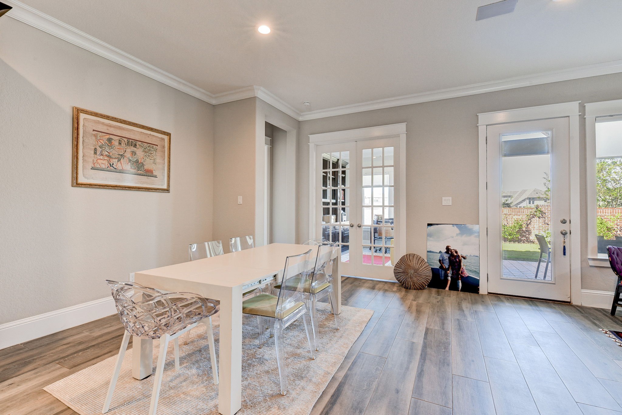 2339 Pale Star Drive Conroe, TX 77384 - Photo 19 of 43 a view of a dining room with furniture and wooden floor