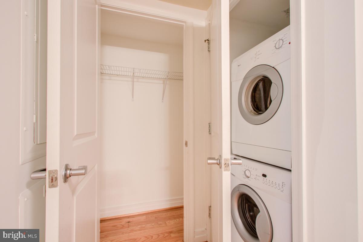 915 E Street Northwest, Unit 101 Washington, DC 20004 - Photo 11 of 34 a view of a hallway with washer and dryer