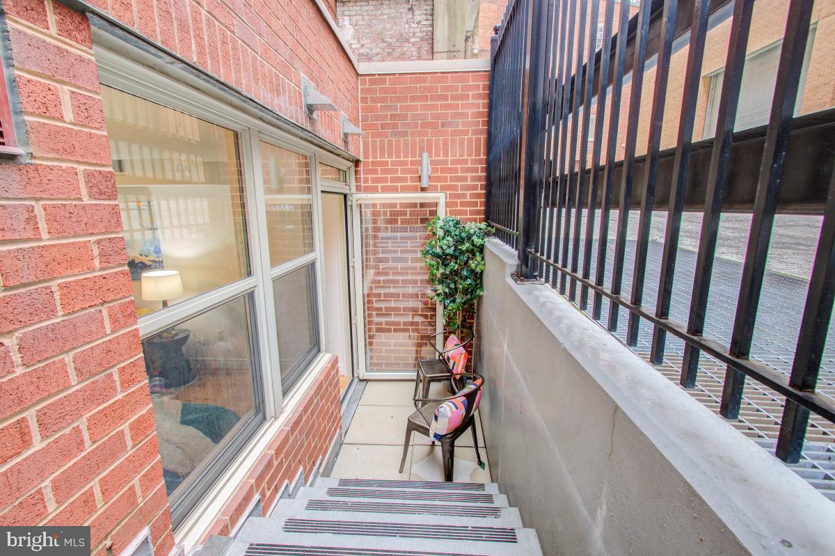 915 E Street Northwest, Unit 101 Washington, DC 20004 - Photo 24 of 34 a view of a balcony with a potted plant