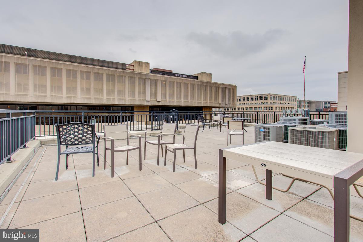 915 E Street Northwest, Unit 101 Washington, DC 20004 - Photo 30 of 34 a view of two chairs and a table in a patio