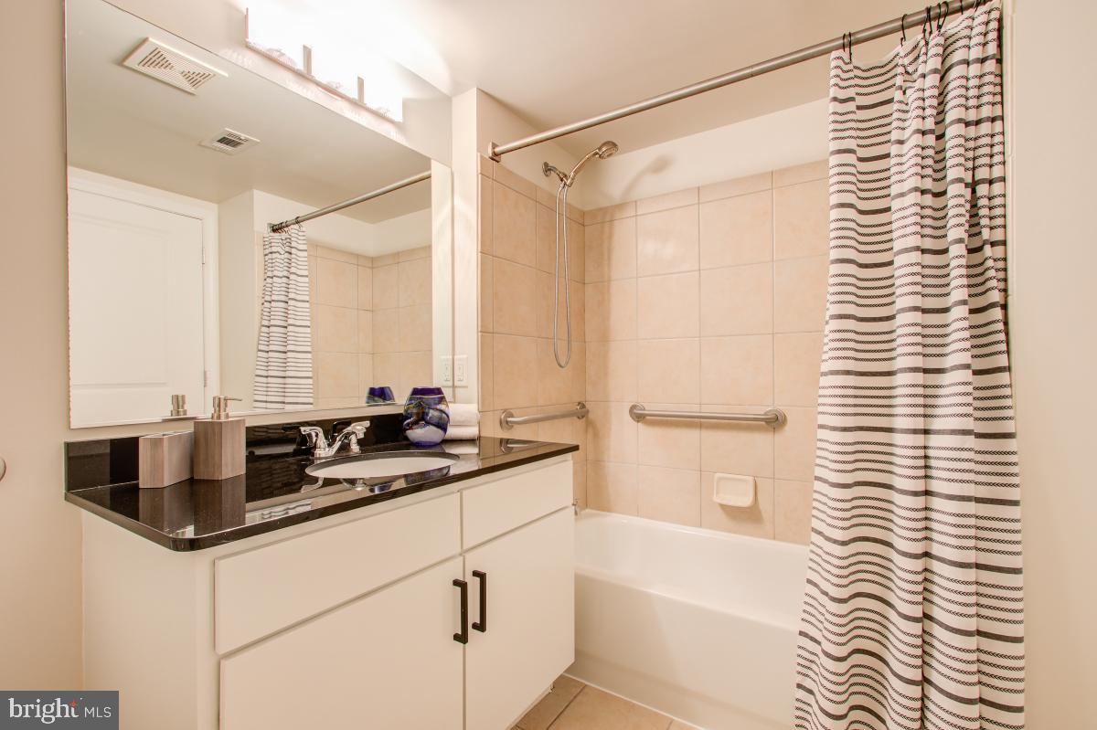 915 E Street Northwest, Unit 101 Washington, DC 20004 - Photo 9 of 34 a bathroom with a sink and a bathtub