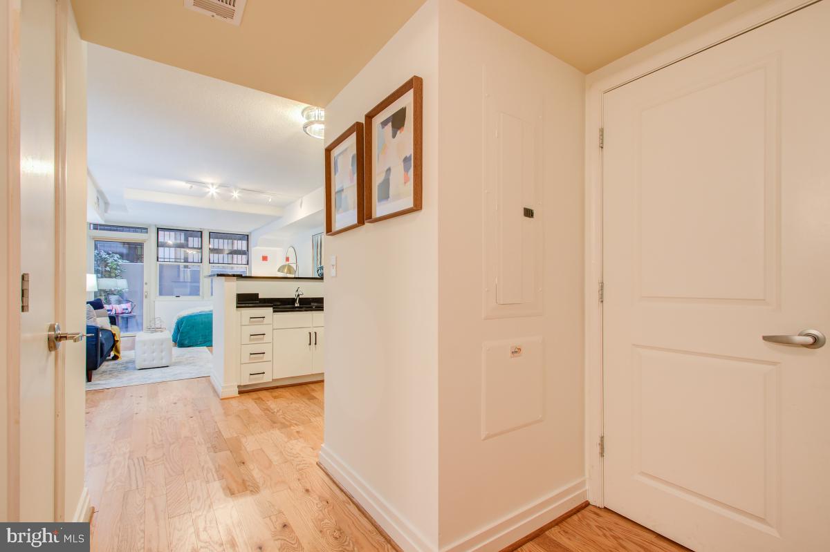 915 E Street Northwest, Unit 101 Washington, DC 20004 - Photo 10 of 34 a view of kitchen with furniture and wooden floor