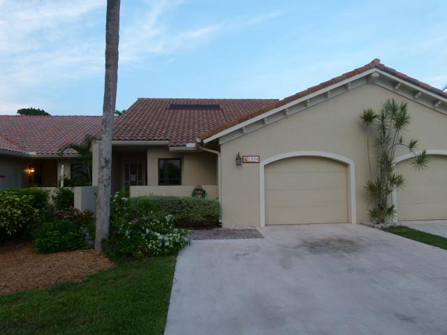 21554 Coronado Avenue Boca Raton, FL 33433 - Photo 2 of 7 a front view of a house with a yard and garage