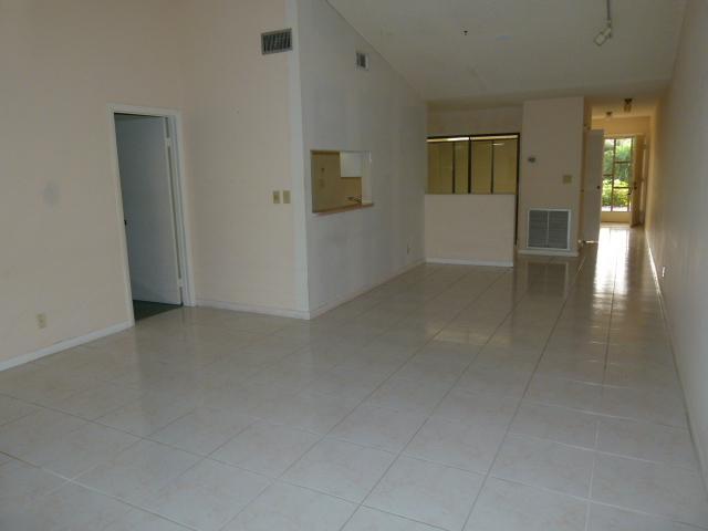 21554 Coronado Avenue Boca Raton, FL 33433 - Photo 5 of 7 an empty room with windows and entrance