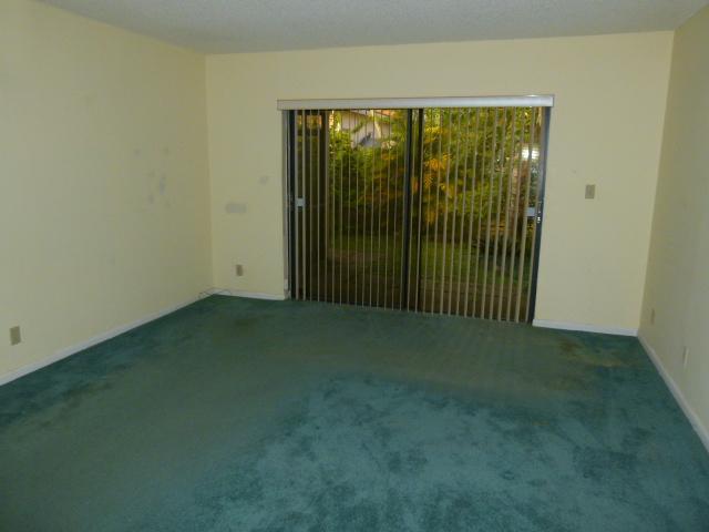 21554 Coronado Avenue Boca Raton, FL 33433 - Photo 6 of 7 a view of an empty room with floor to ceiling window