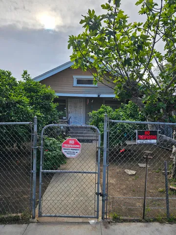 a view of a backyard with sitting area