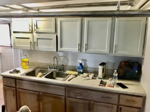 a kitchen with a sink and cabinets