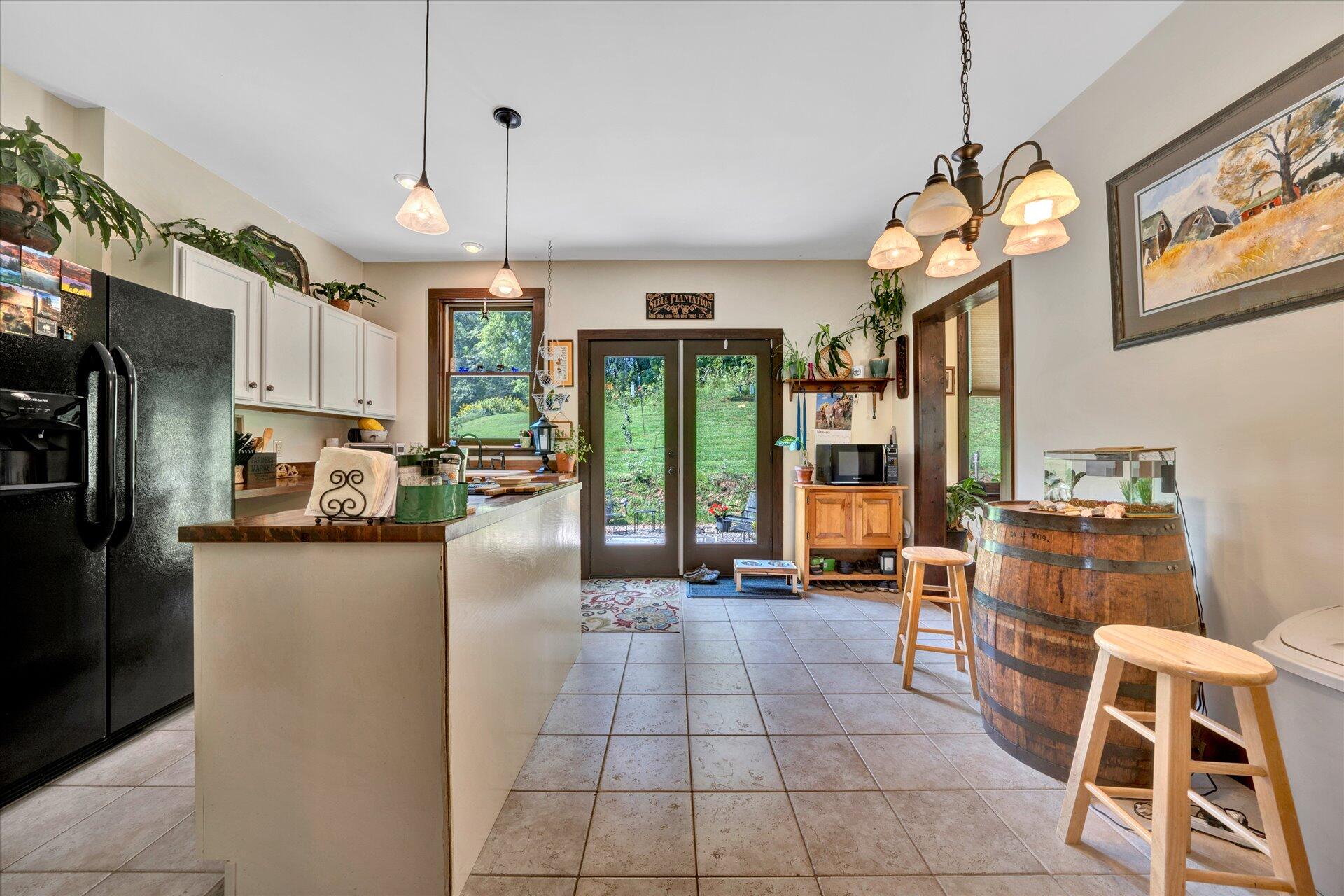2235 Dillons Mill Road Callaway, VA 24067 - Photo 14 of 40 a kitchen with stainless steel appliances granite countertop a refrigerator and a stove