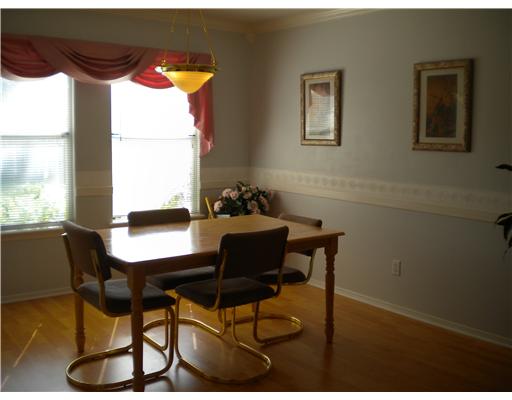 4413 Silver Hollow Drive, Unit 1 Corpus Christi, TX 78413 - Photo 5 of 10 a view of a dining room with furniture and window in it