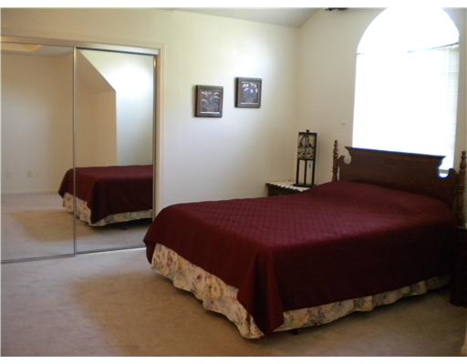 4413 Silver Hollow Drive, Unit 1 Corpus Christi, TX 78413 - Photo 6 of 10 a bedroom with a bed and a couch