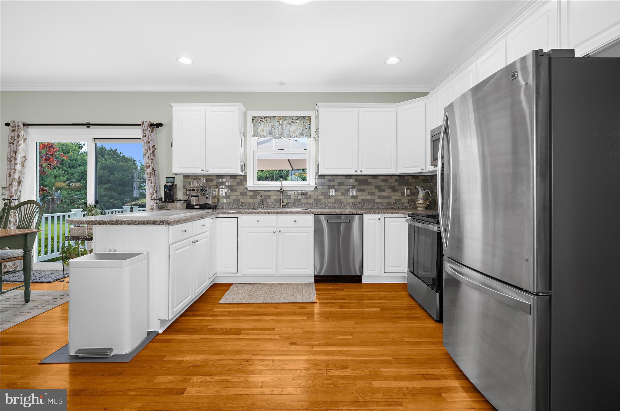 988 White Marsh Road Centreville, MD 21617 - Photo 13 of 96 a kitchen with stainless steel appliances a refrigerator sink and cabinets