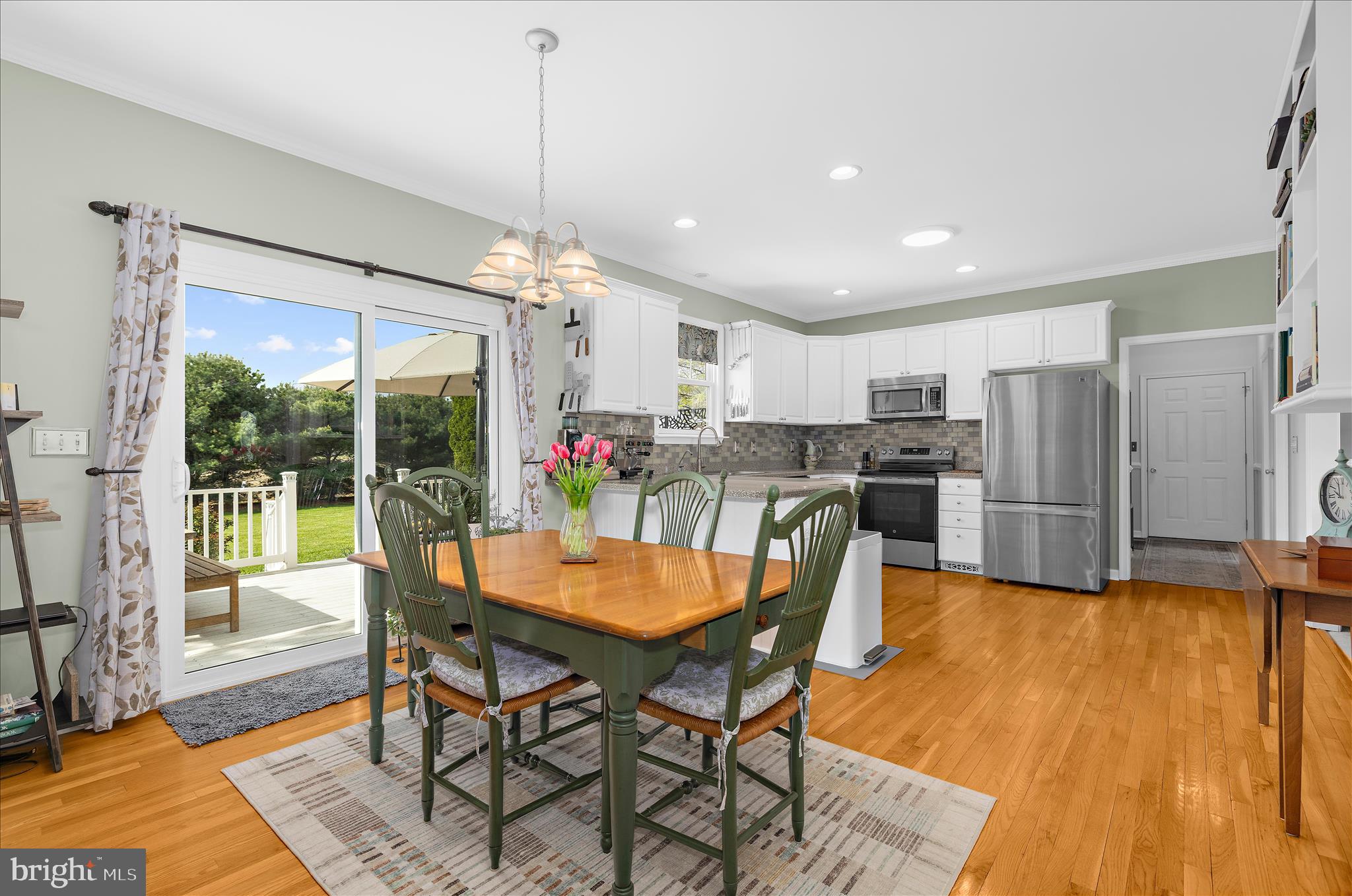 988 White Marsh Road Centreville, MD 21617 - Photo 18 of 96 a view of a dining room with furniture and a chandelier