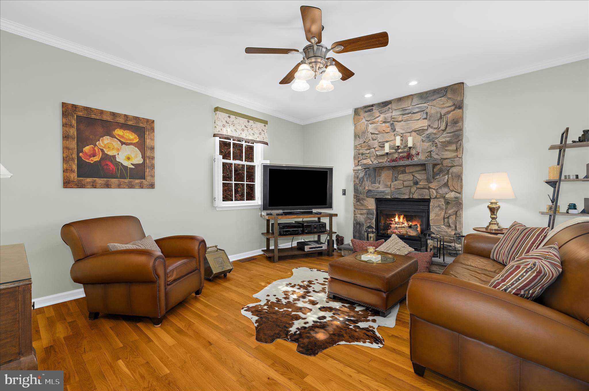 988 White Marsh Road Centreville, MD 21617 - Photo 22 of 96 a living room with furniture a flat screen tv and a fireplace