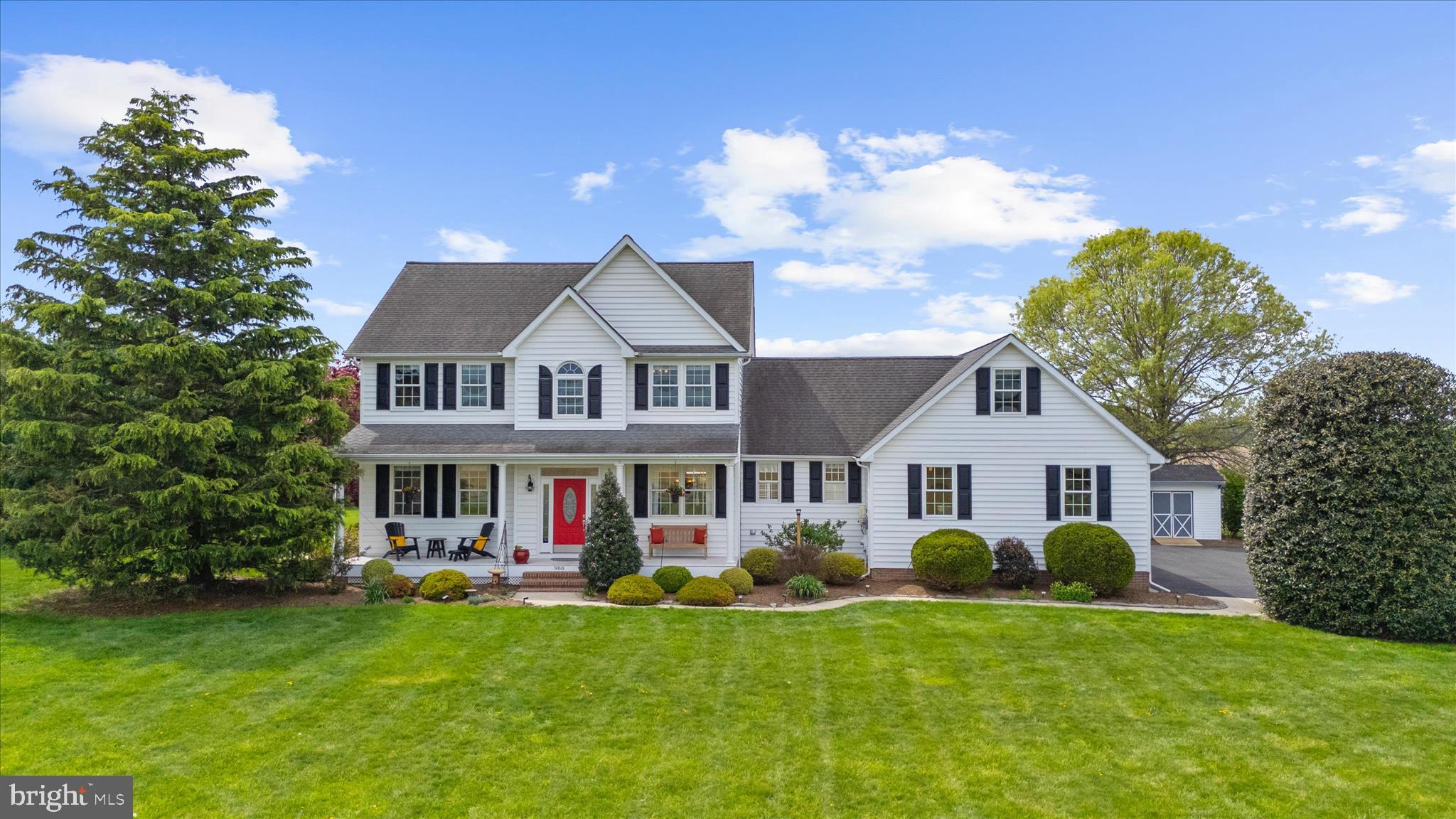 988 White Marsh Road Centreville, MD 21617 - Photo 4 of 96 a front view of a house with a yard table and chairs