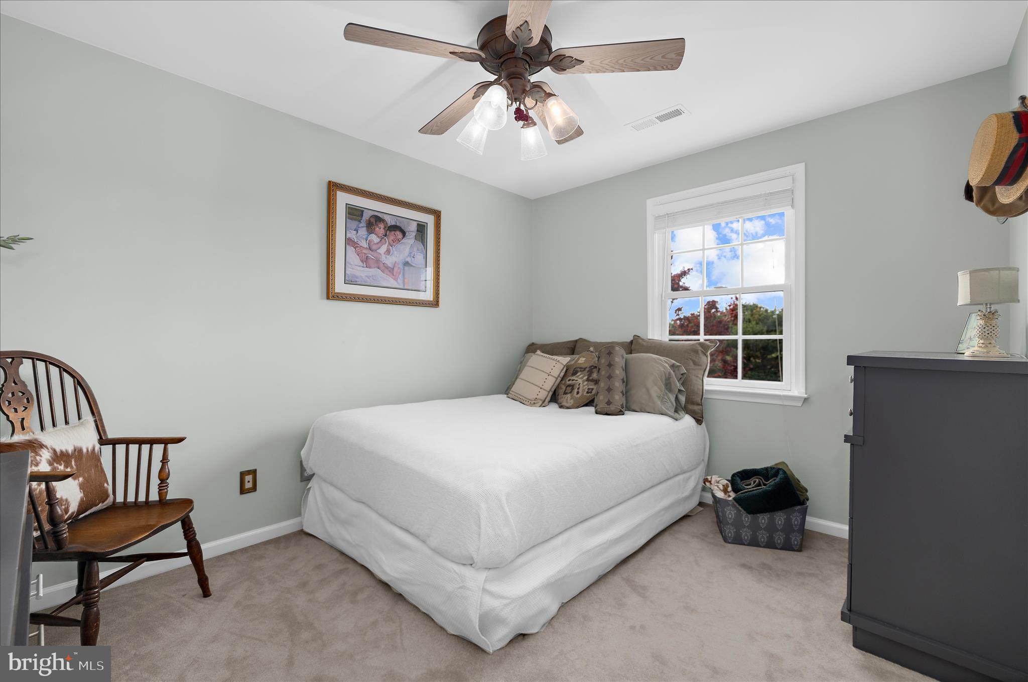 988 White Marsh Road Centreville, MD 21617 - Photo 47 of 96 a bedroom with a bed and a chandelier