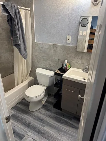 a bathroom with a toilet and a sink