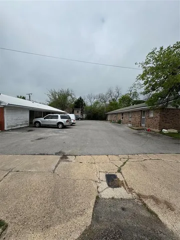 a view of a street with cars
