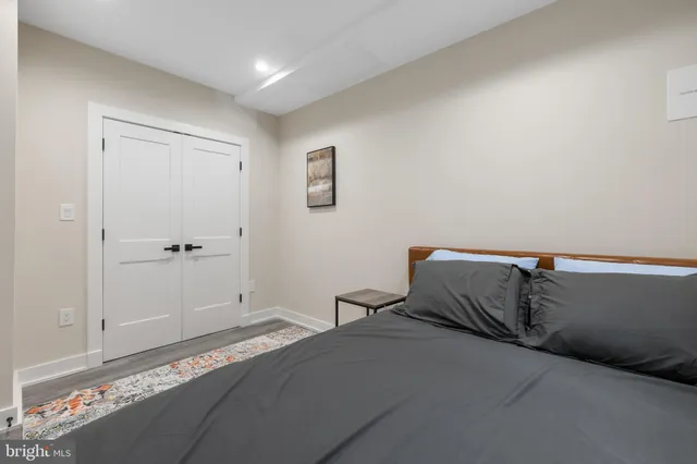 a bedroom with a bed and cabinets