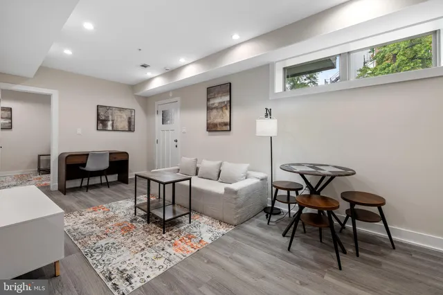 a living room with furniture and a table