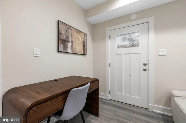 a workspace room with a bed and a chair