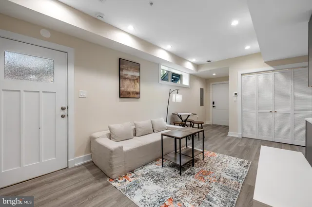a living room with furniture and a rug