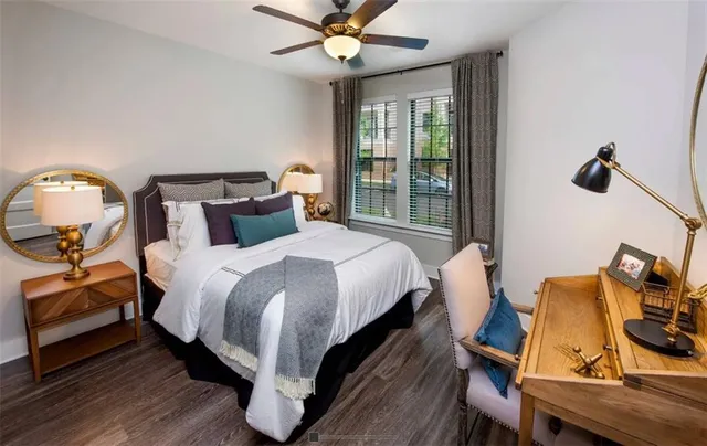 a bed room with a bed and a chandelier