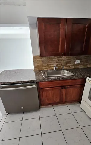a living room with a large mirror and a rug
